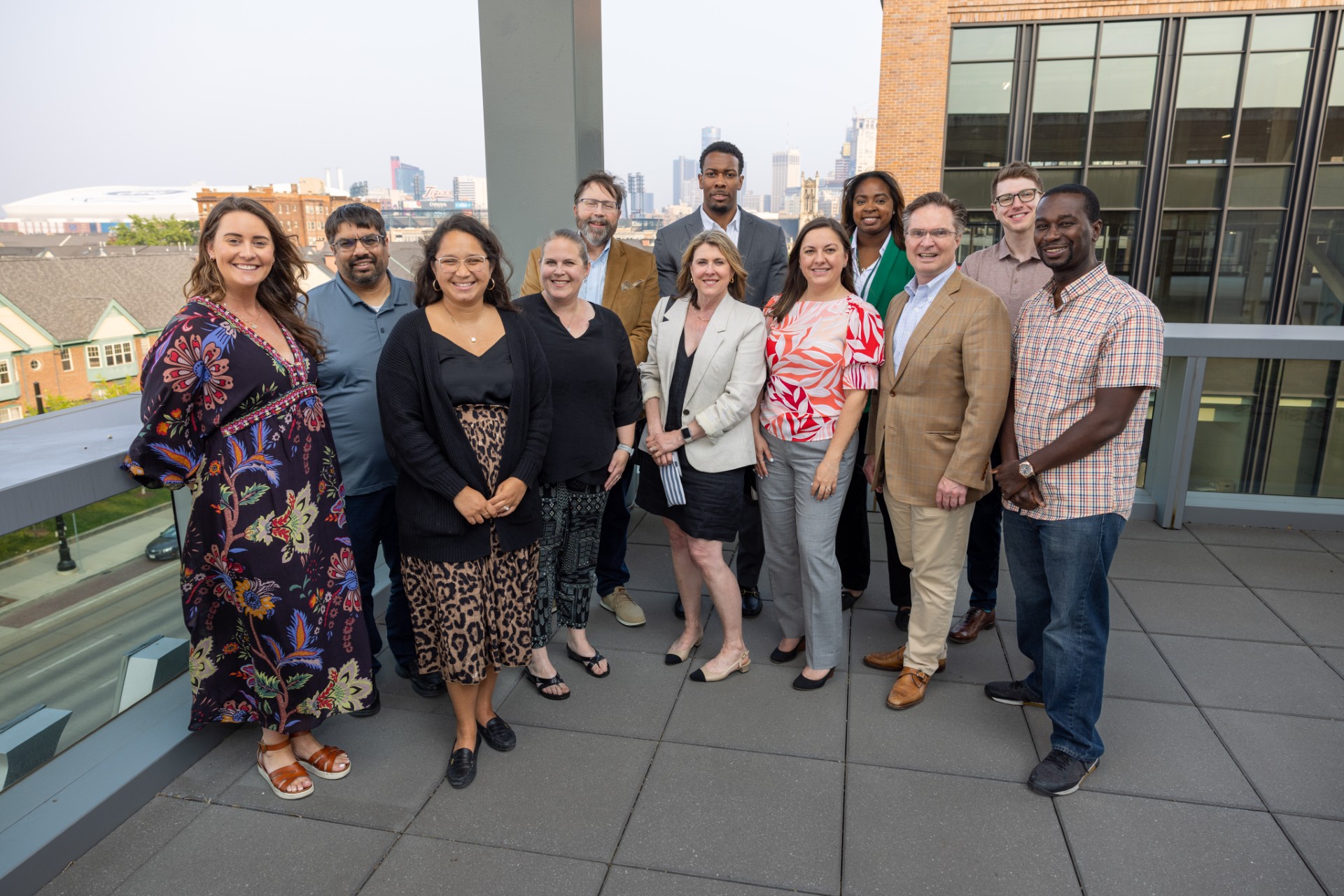 Group photo of the Ilitch School Alumni Council on the outdoor terrace of the Ilitch School of Business