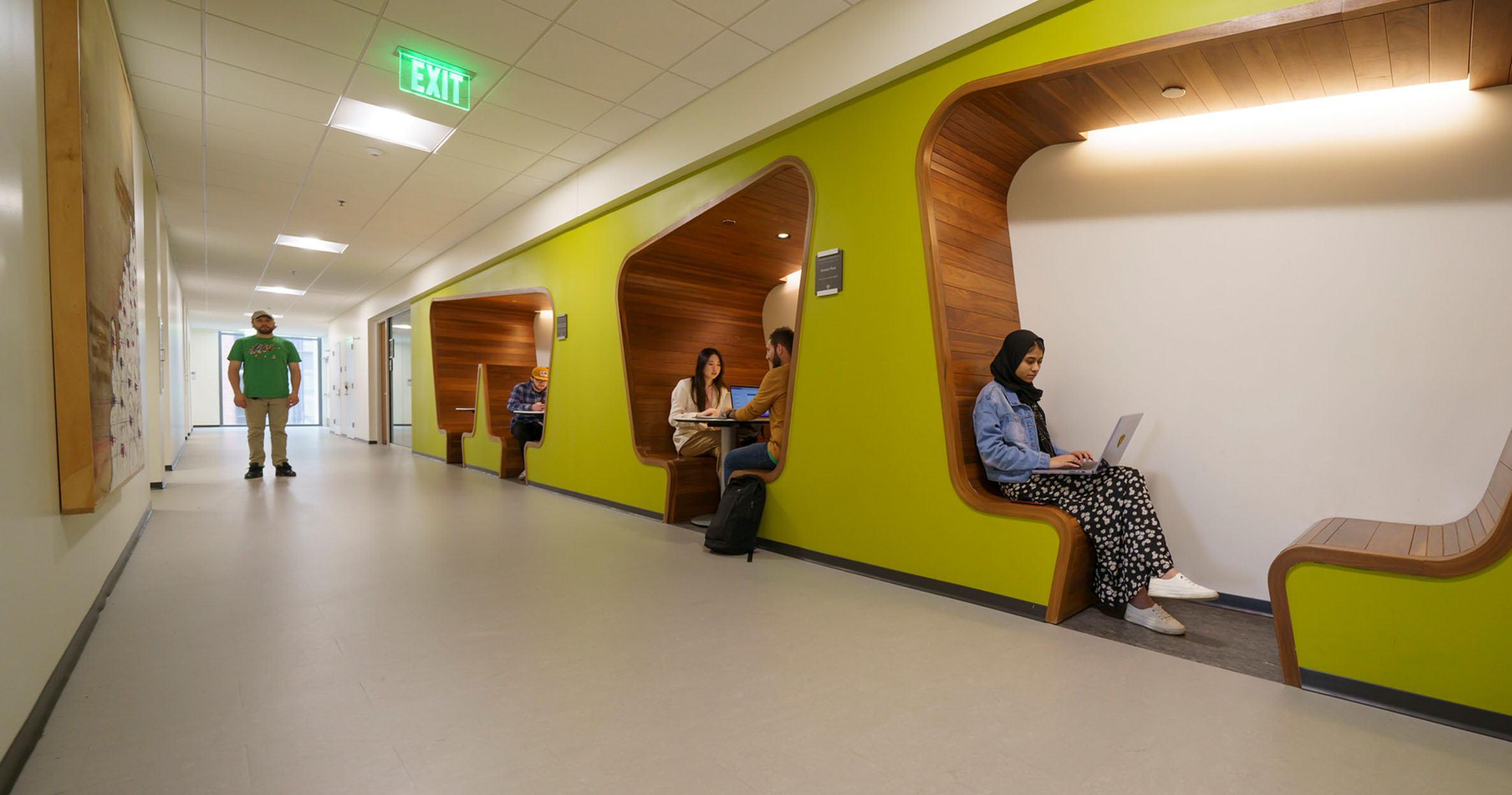 Students sit in study nooks to in the Mike Ilitch School of Business building