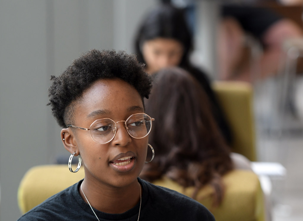 Female student inside looking to her left