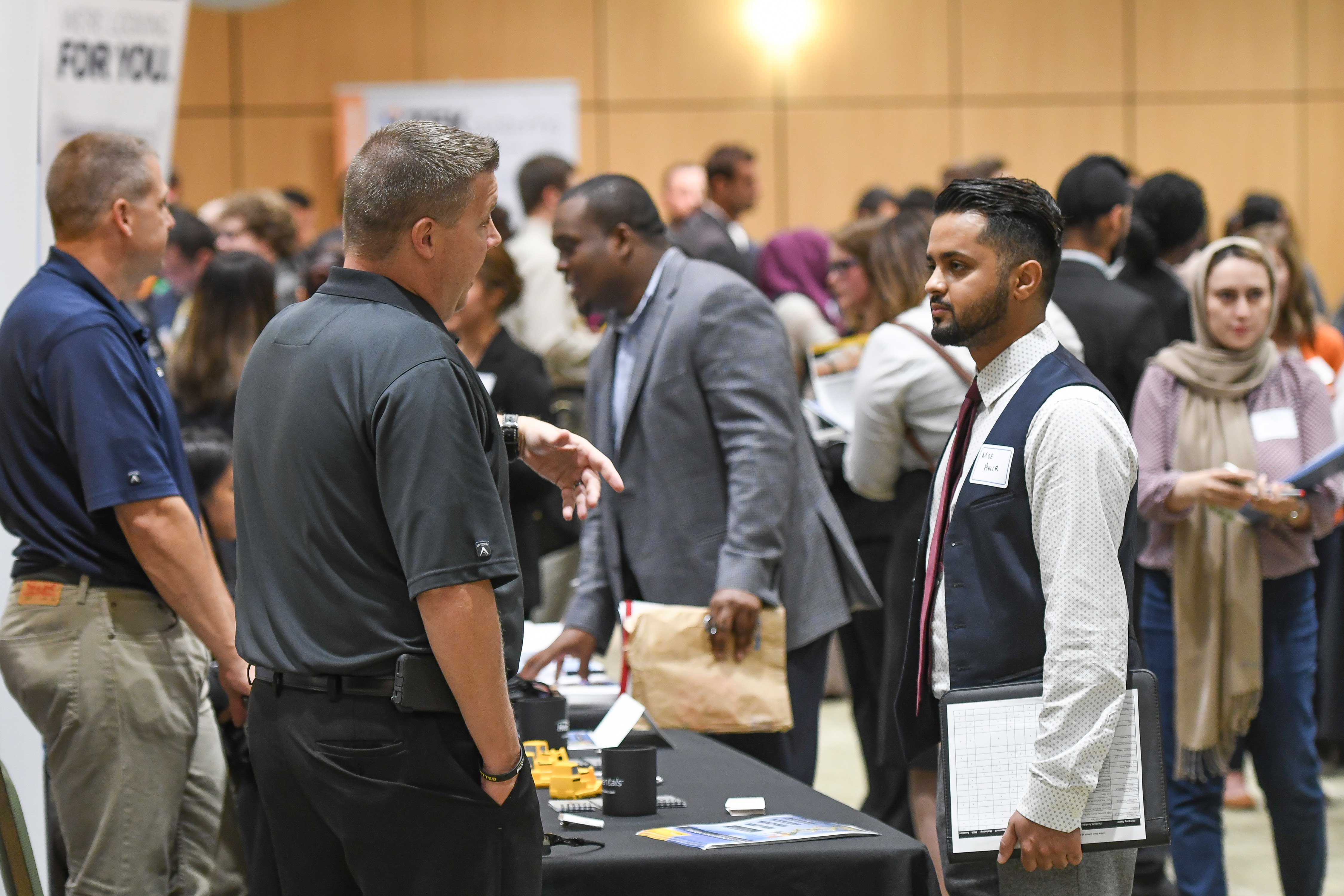 Student talking to company rep at career fair